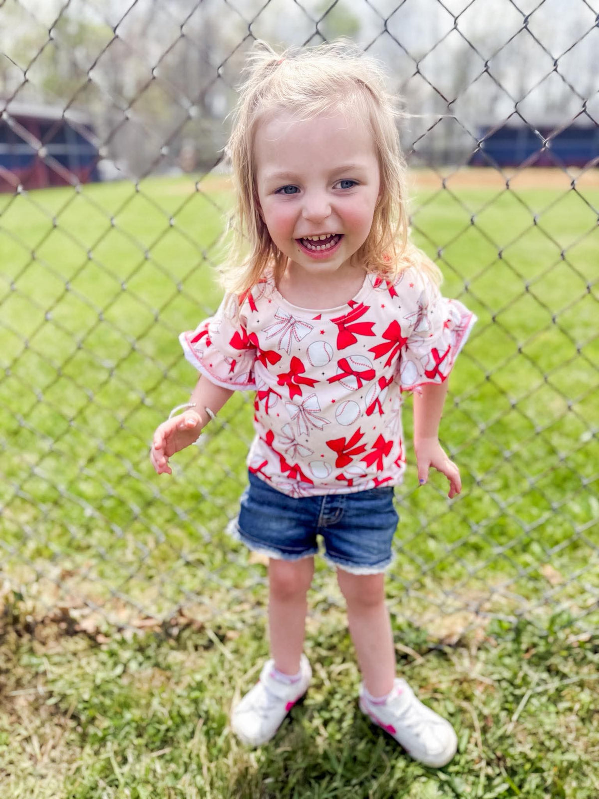 Baseball bows ruffle top